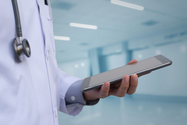 Doctor Using Digital Tablet